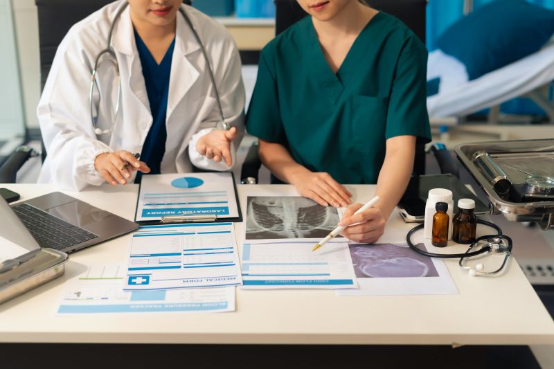 Medical team working on digital tablet healthcare doctor technology tablet using computer analyzed the results of medical reports, an online conference at the hospital.