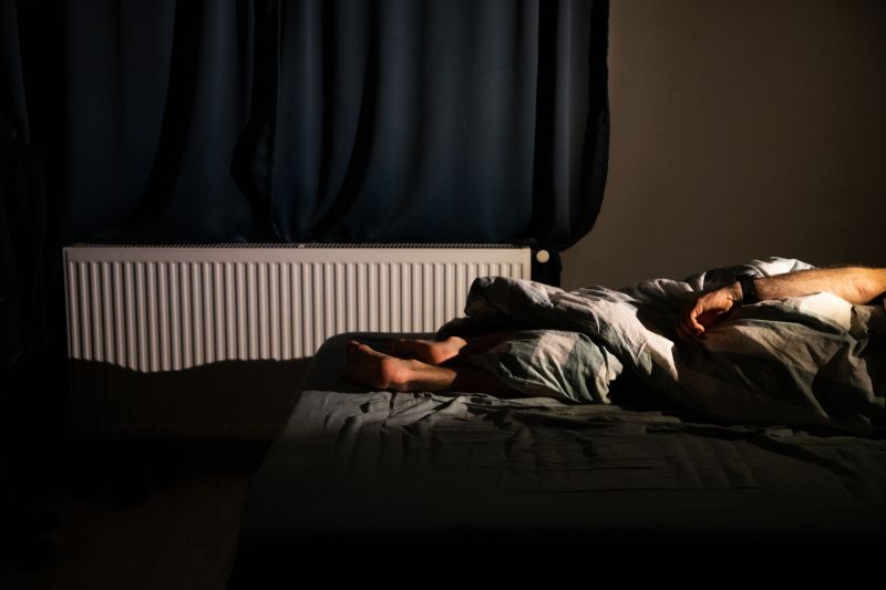 Man,Sleeping,In,Bed,At,Night,Sleep,Quality,Insomnia